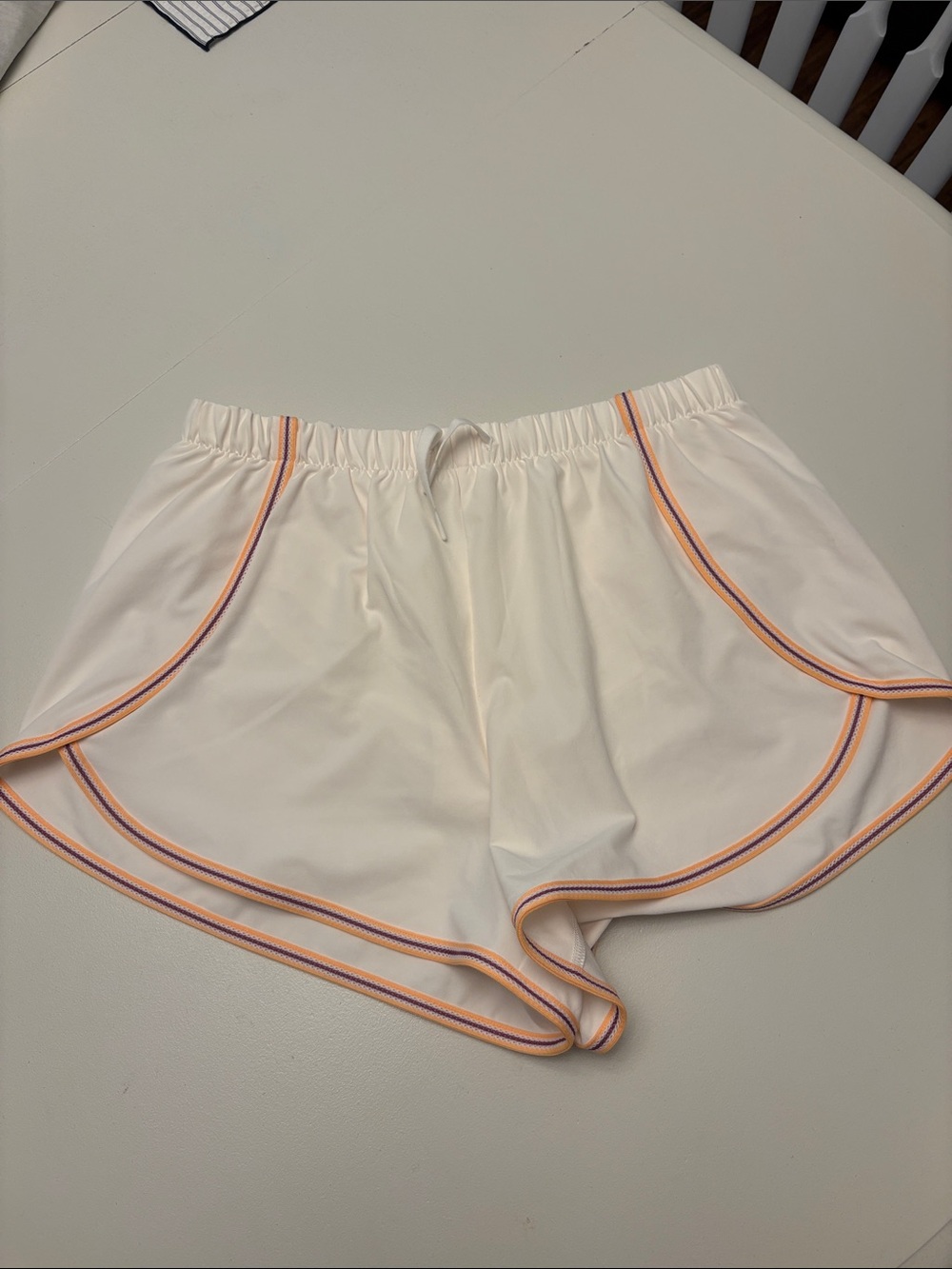all in motion Cream Athletic Shorts with Orange and Purple Trim